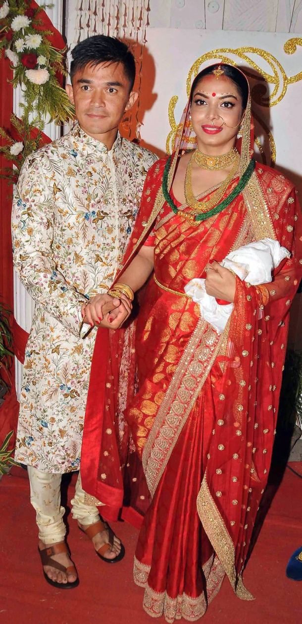 Kolkata: Indian football captain Sunil Chhetri with his wife Sonam posing after their wedding at Ordnance Club in Kolkata on Monday late evening. PTI Photo (PTI12_4_2017_000229A)